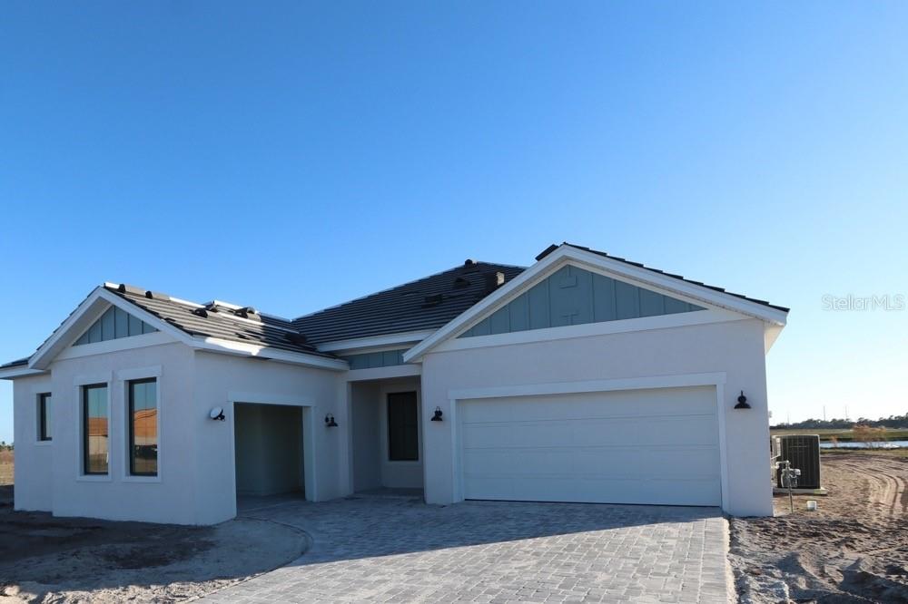 17547 Foxtail Loop Venice, FL 34293 - Photo 1 of 11 a front view of a house with a yard