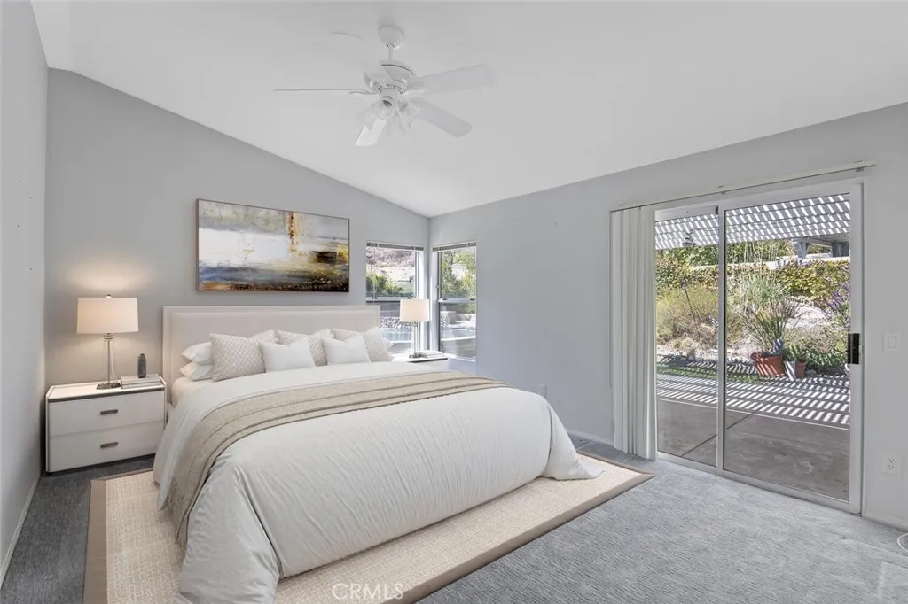 27619 Ron Ridge Drive Saugus, CA 91350 - Photo 17 of 37 a bedroom with a large bed and a tv