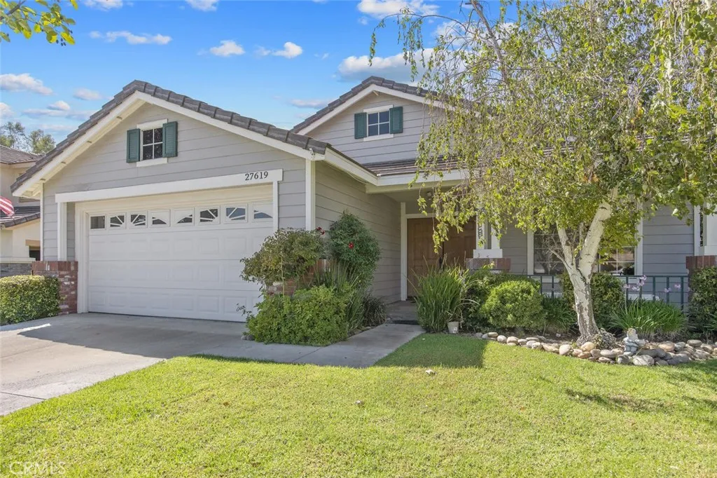 27619 Ron Ridge Drive Saugus, CA 91350 - Photo 2 of 37 a front view of house with yard and green space