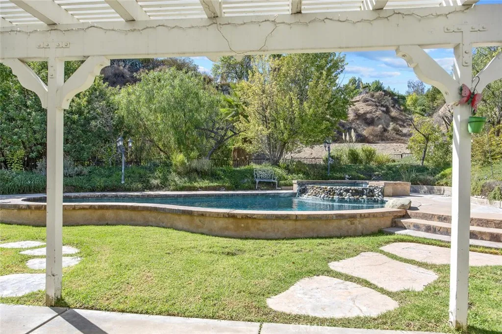 27619 Ron Ridge Drive Saugus, CA 91350 - Photo 24 of 37 a view of a swimming pool with a patio