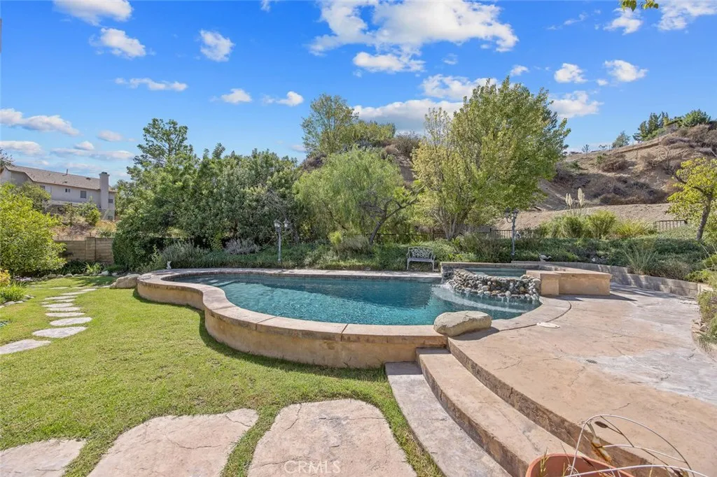 27619 Ron Ridge Drive Saugus, CA 91350 - Photo 34 of 37 a view of a swimming pool with a patio