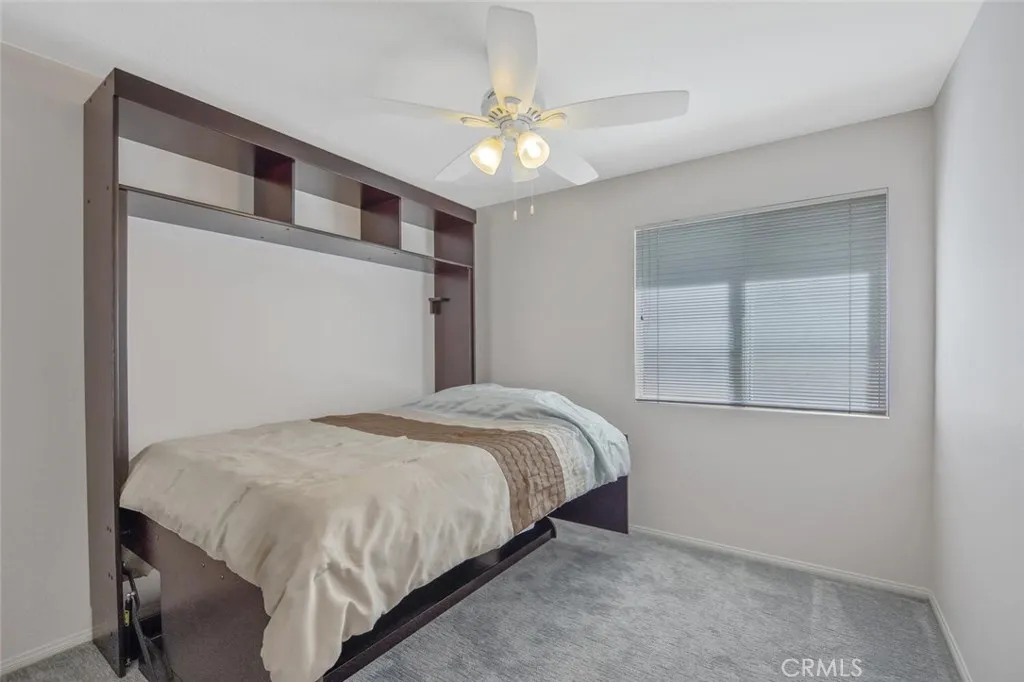 27619 Ron Ridge Drive Saugus, CA 91350 - Photo 36 of 37 a bedroom with a bed and a chandelier