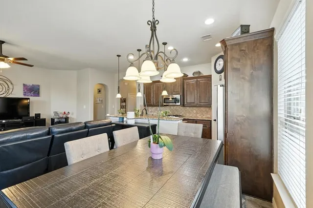 a view of dining room and hall with furniture