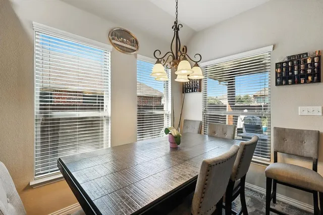 a bedroom with bed couch and window