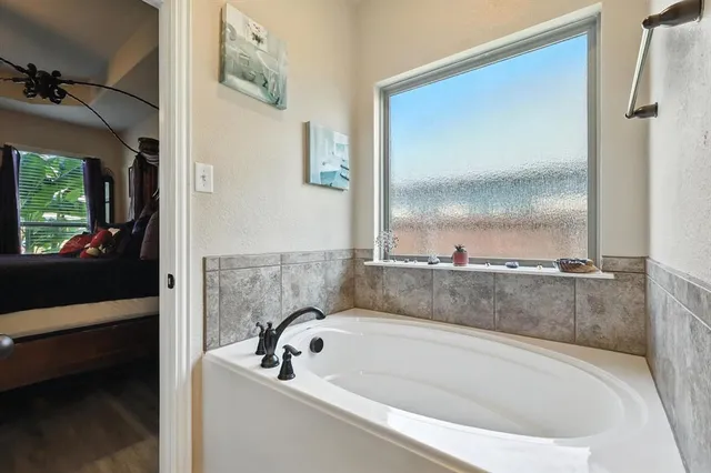 a bathroom with a double vanity sink and a mirror