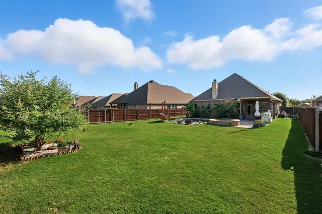 a view of a garden with houses