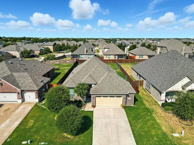 an aerial view of houses with outdoor space
