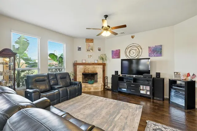 a living room with furniture and kitchen view