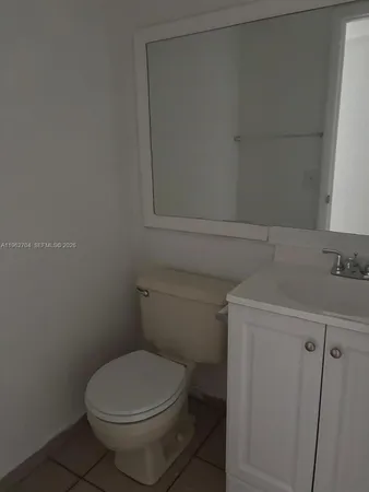 a bathroom with a toilet and a sink