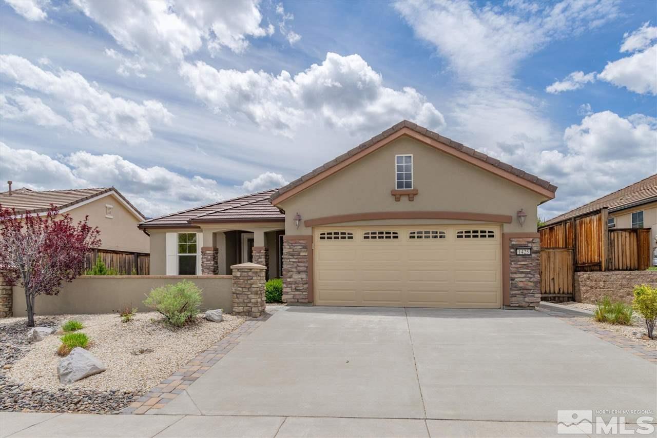 1425 Meridian Ranch Drive Reno, NV 89523 - Photo 1 of 40 a front view of a house with a garden
