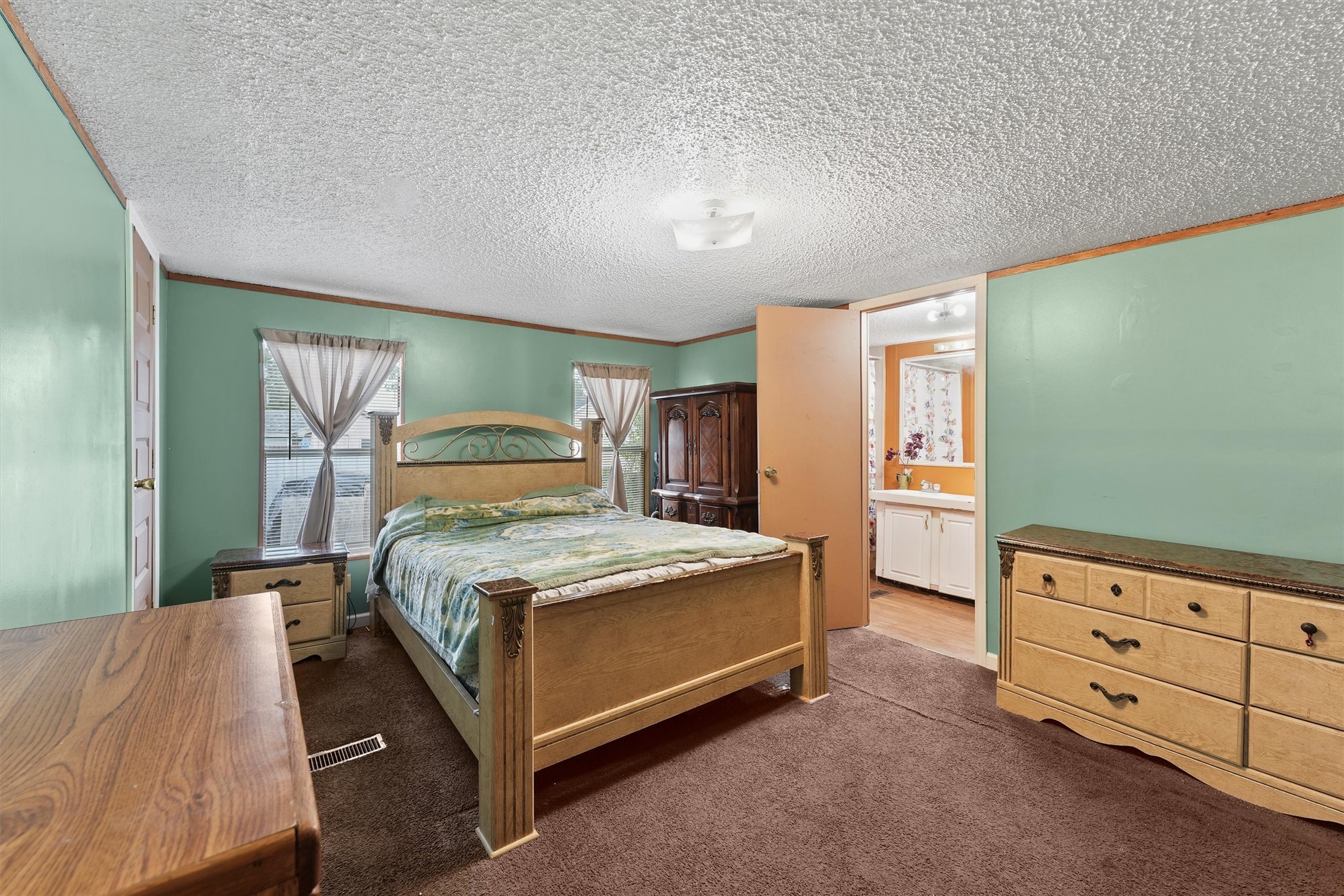 3610 Nuggent Street Houston, TX 77093 - Photo 12 of 16 a bedroom with a bed and a dresser