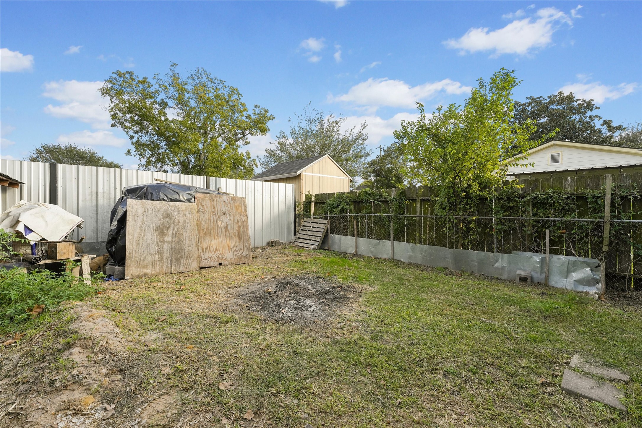 3610 Nuggent Street Houston, TX 77093 - Photo 15 of 16 a view of a backyard with a garden and entertaining space
