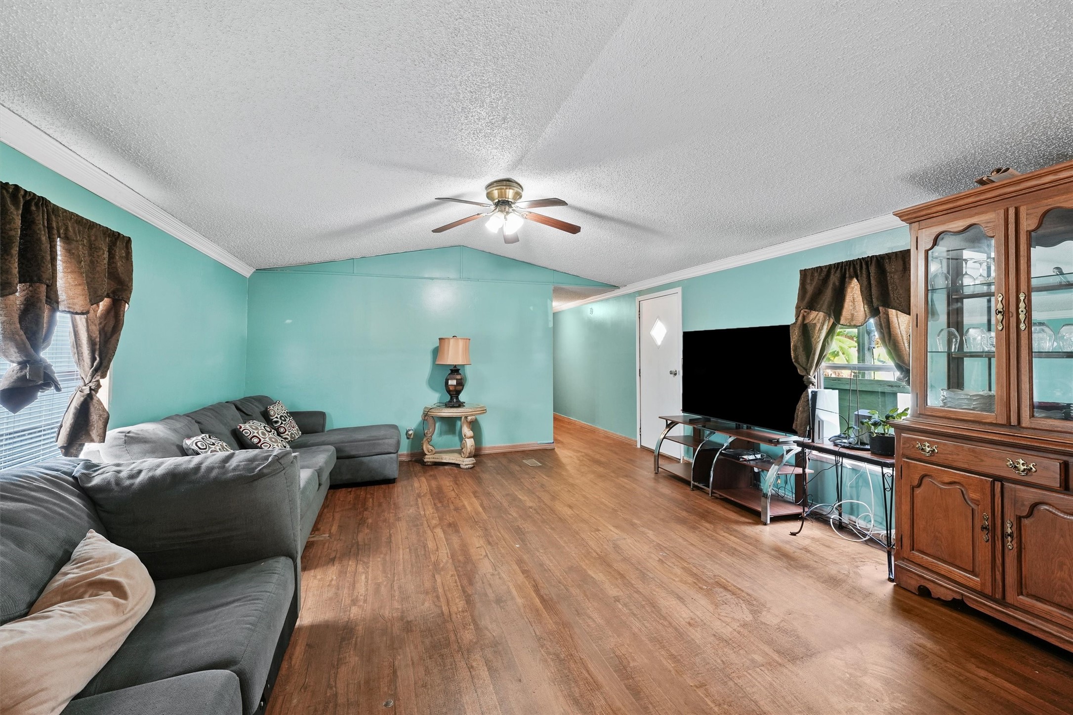 3610 Nuggent Street Houston, TX 77093 - Photo 4 of 16 a living room with furniture and a flat screen tv
