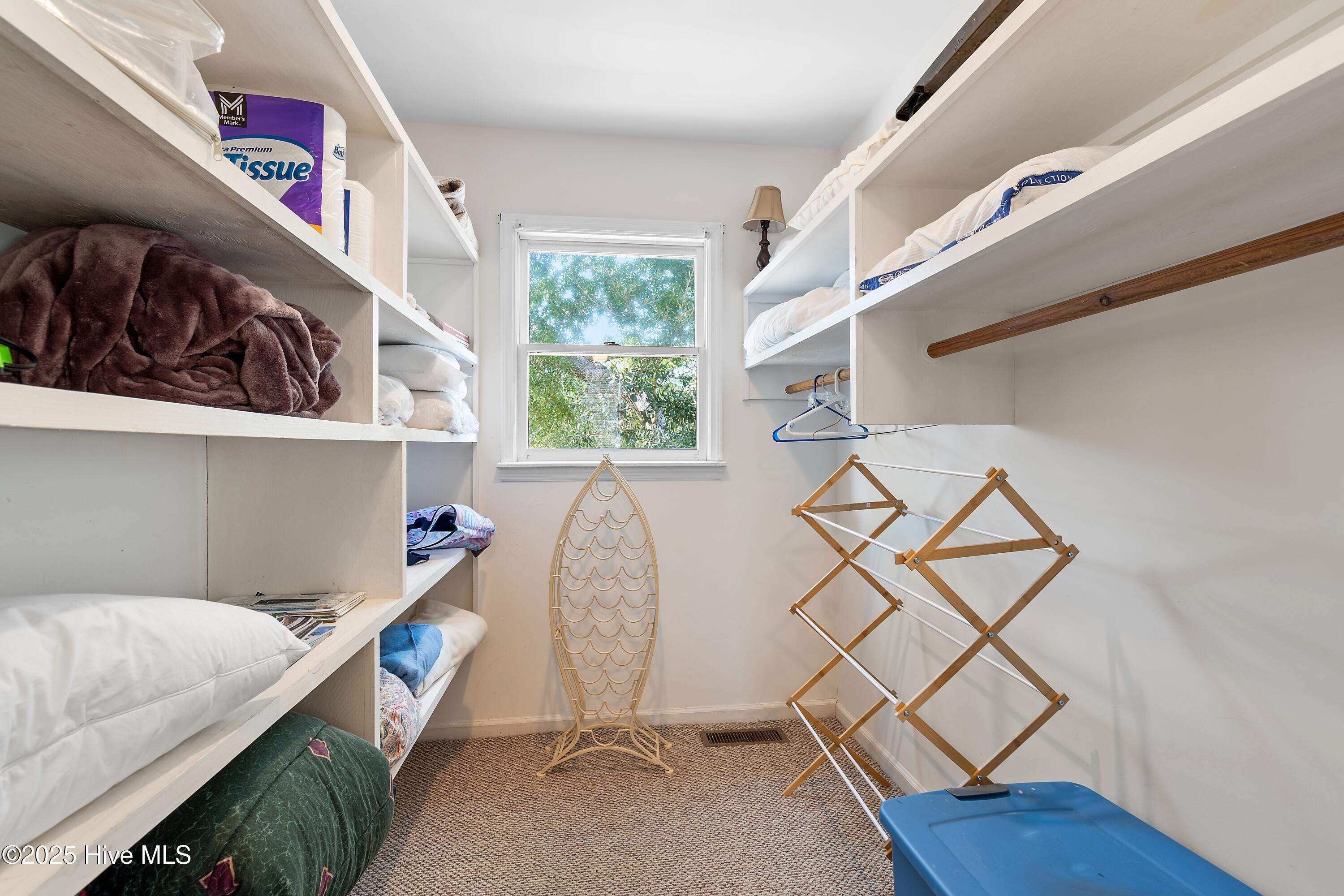 166 Northwest 7th Street Oak Island, NC 28465 - Photo 25 of 39 Closet in guest bedroom