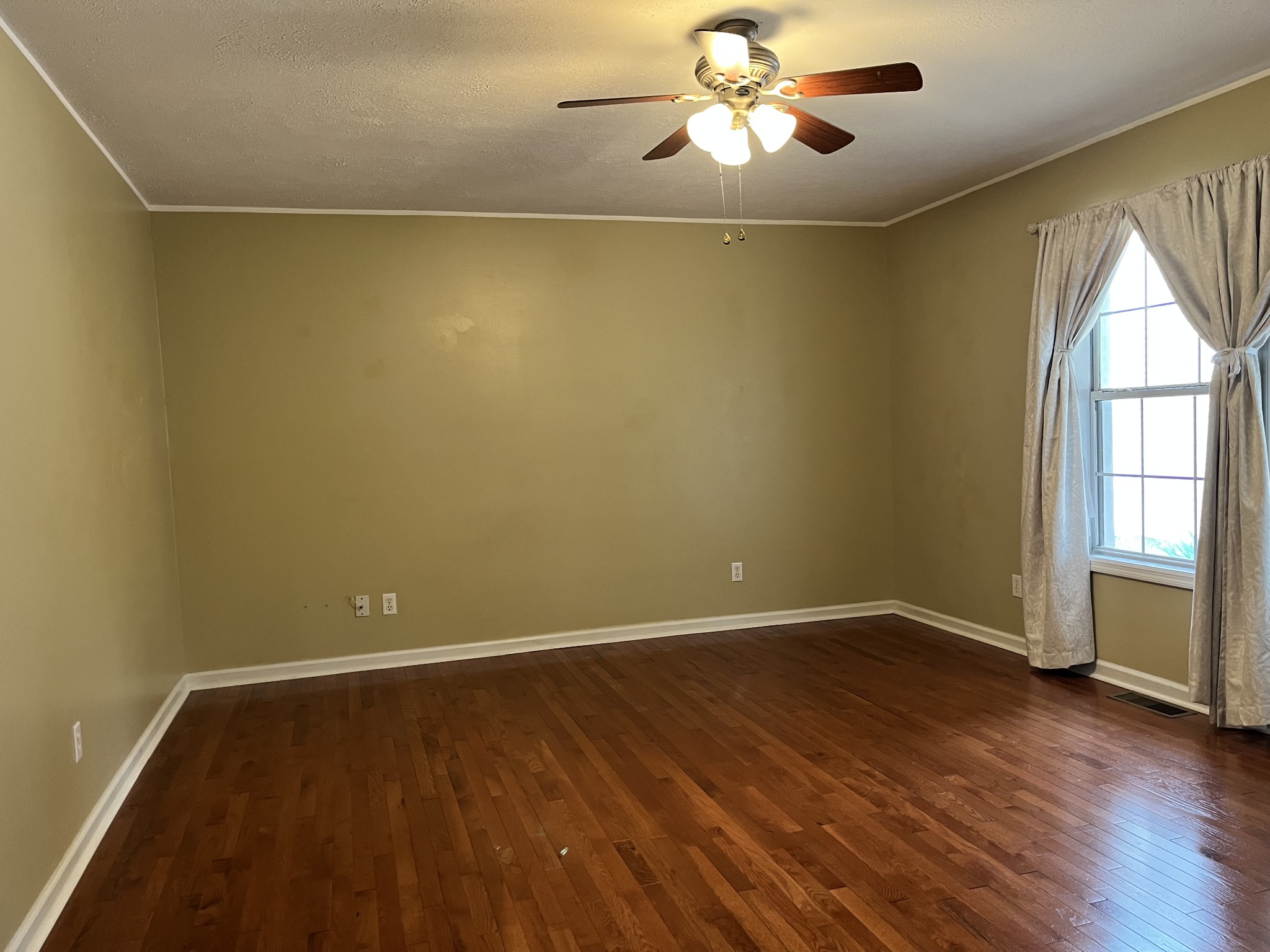 1763 Highway 166 Mount Pleasant, TN 38474 - Photo 12 of 40 wooden floor in an empty room with a window
