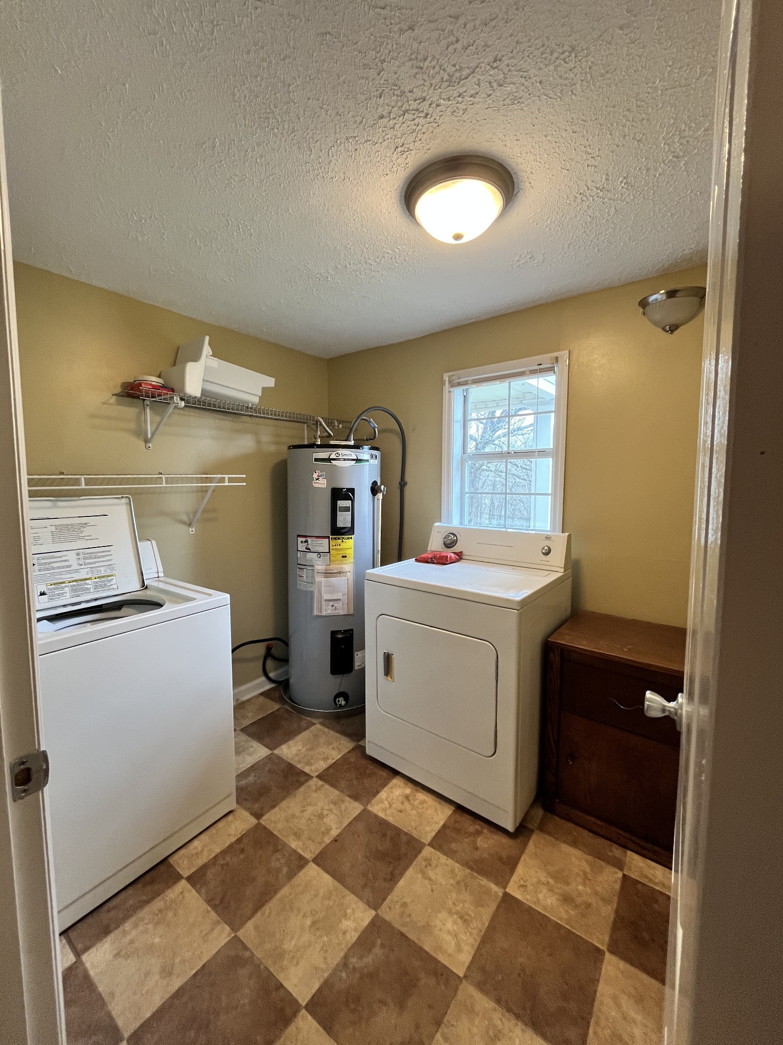 1763 Highway 166 Mount Pleasant, TN 38474 - Photo 18 of 40 a utility room with cabinets washer and dryer