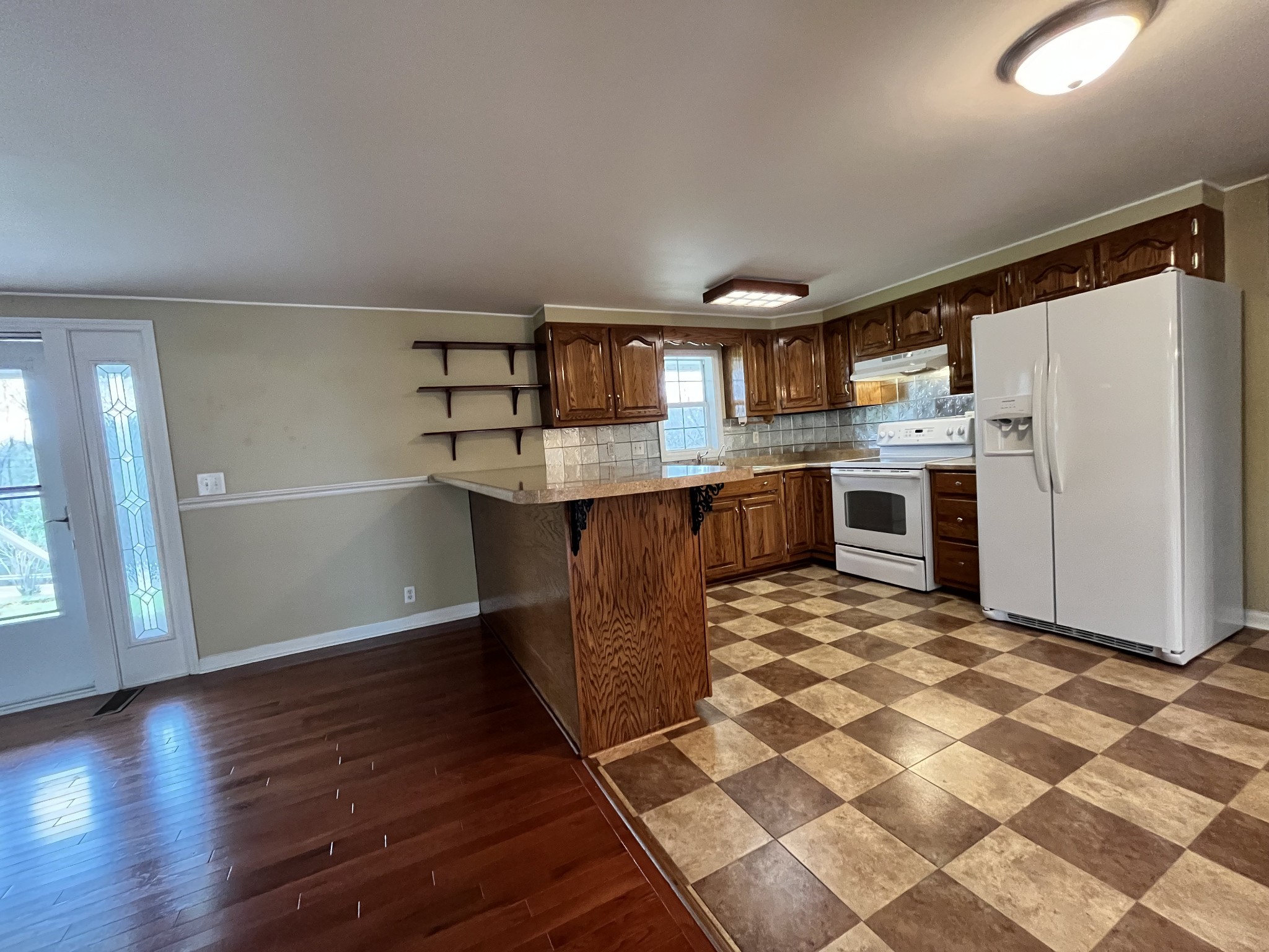 1763 Highway 166 Mount Pleasant, TN 38474 - Photo 20 of 40 a kitchen with stainless steel appliances granite countertop a refrigerator and a stove top oven