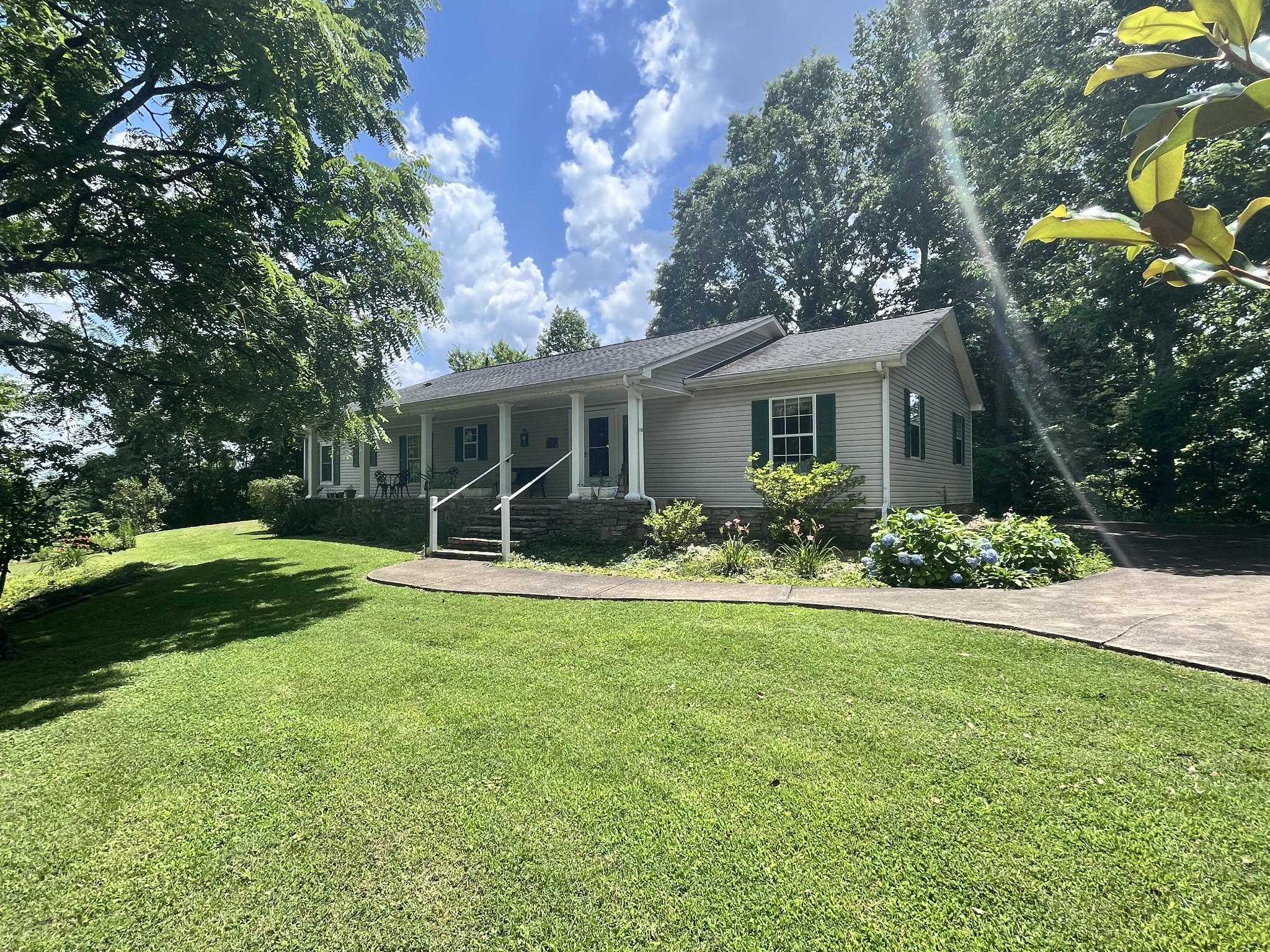 1763 Highway 166 Mount Pleasant, TN 38474 - Photo 7 of 40 a view of backyard of house with green space