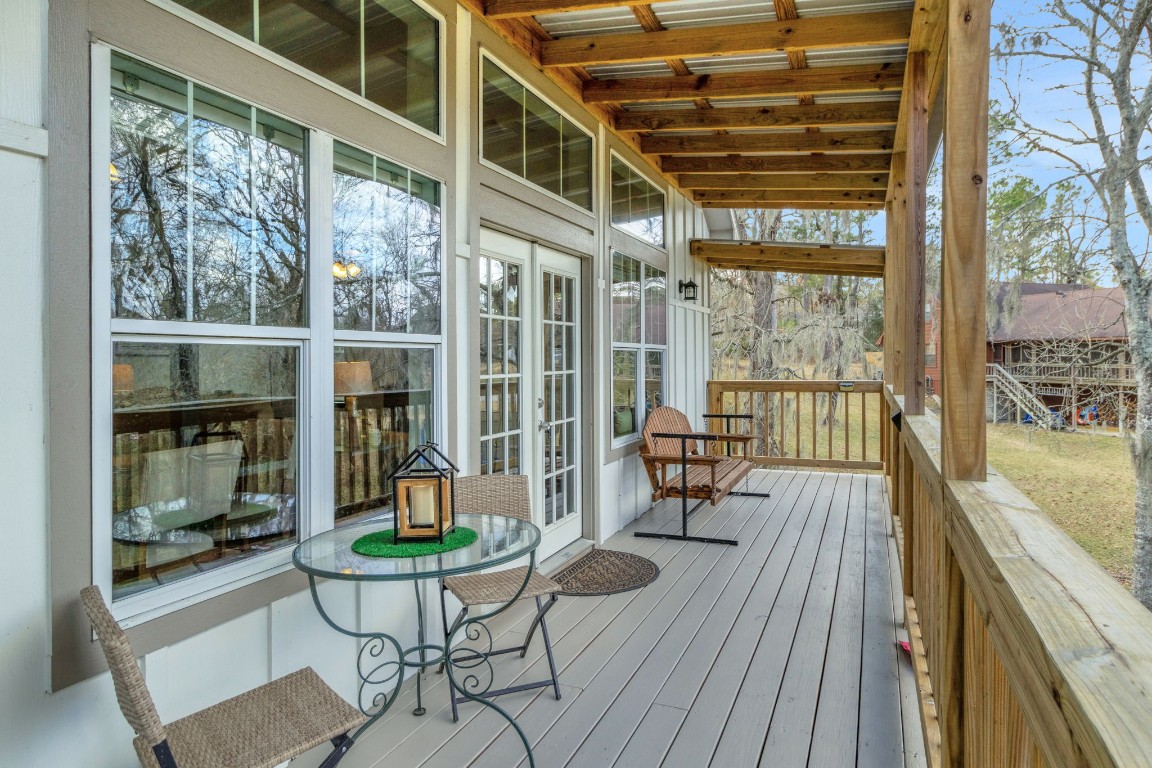 171 Kings Way Coldspring, TX 77331 - Photo 13 of 50 The back deck off the living area is covered and freshly painted