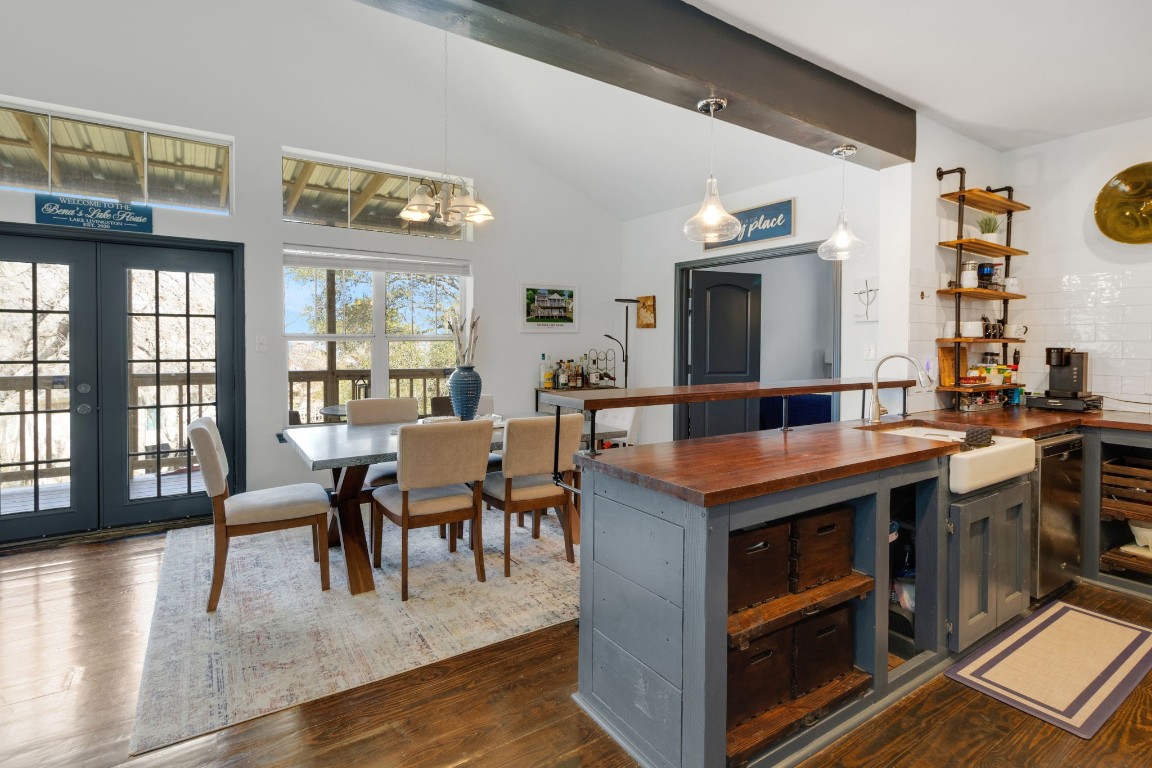 171 Kings Way Coldspring, TX 77331 - Photo 7 of 50 a view of a dining room with furniture a chandelier and wooden floor