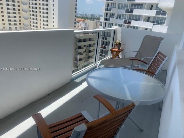 100 Lincoln Road, Unit 1434 Miami Beach, FL 33139 - Photo 7 of 29 a view of a chair and table in the balcony