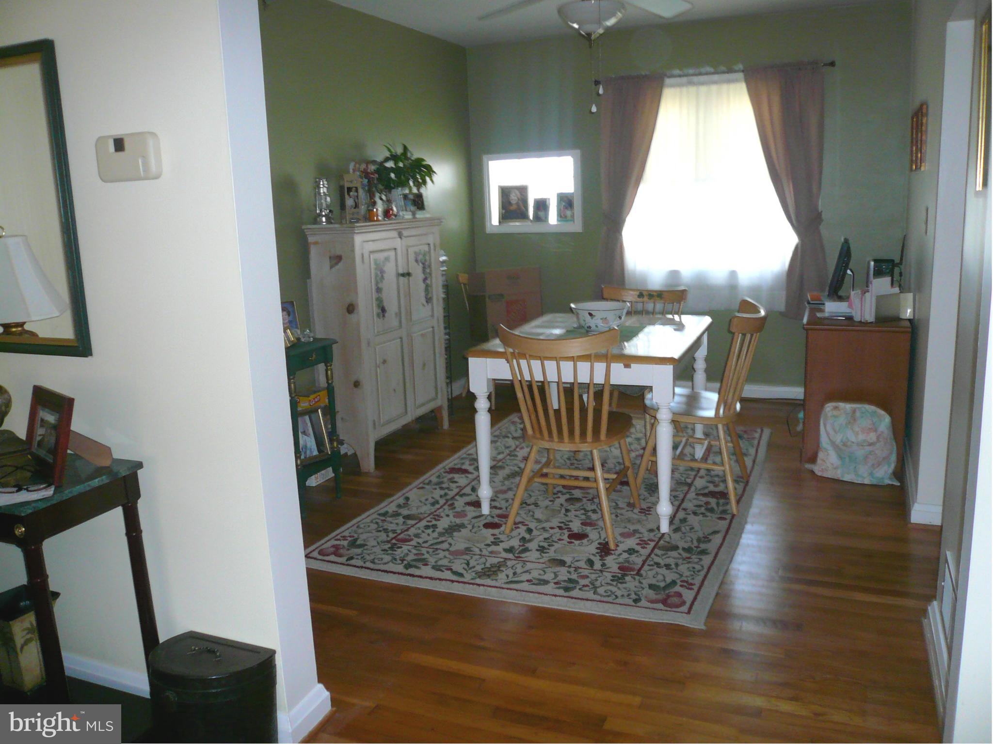 2018 Ormand Road Baltimore, MD 21222 - Photo 12 of 21 a dining room with chandelier and wooden floor