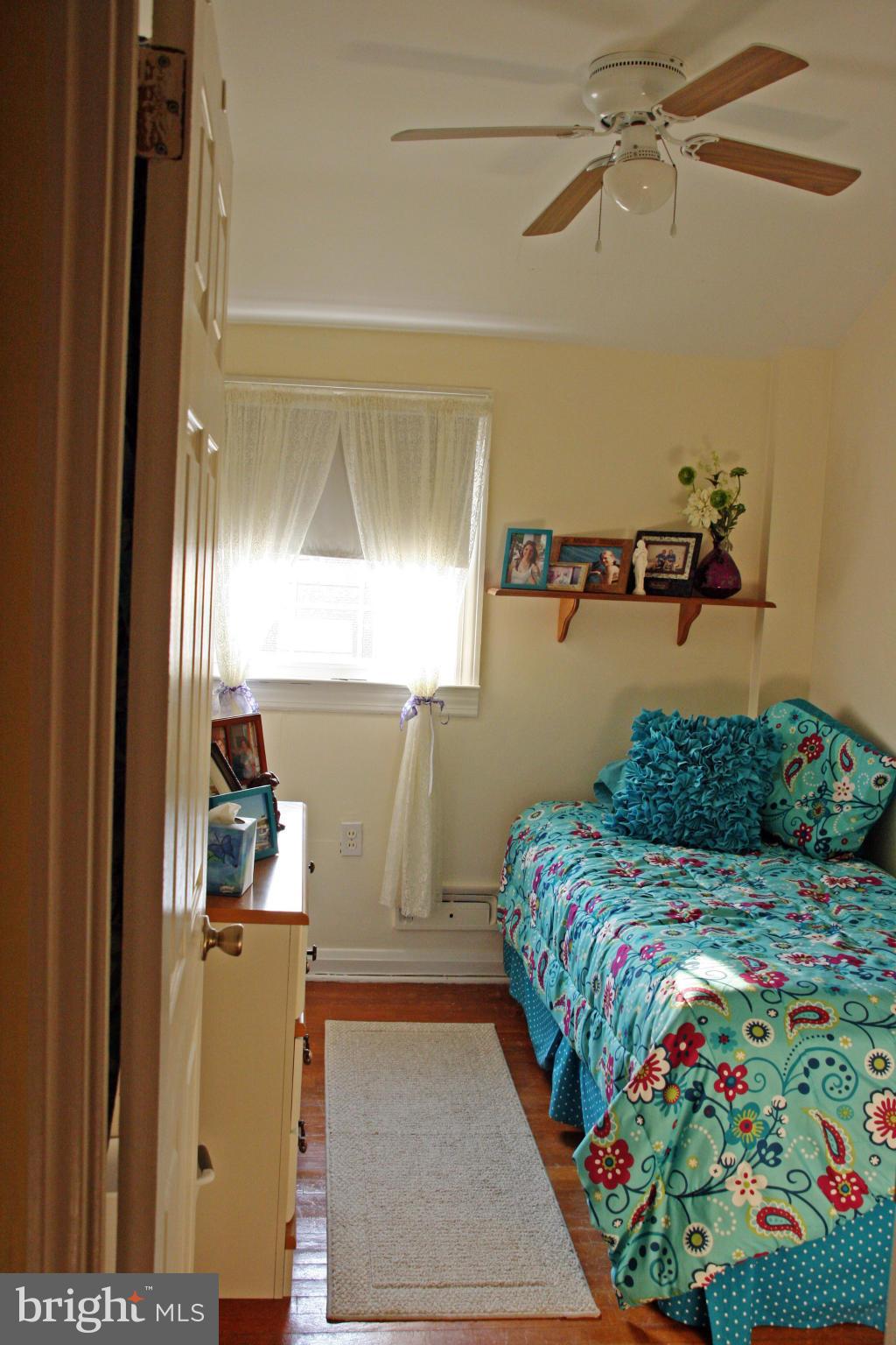 2018 Ormand Road Baltimore, MD 21222 - Photo 15 of 21 a bedroom with a bed and a dresser