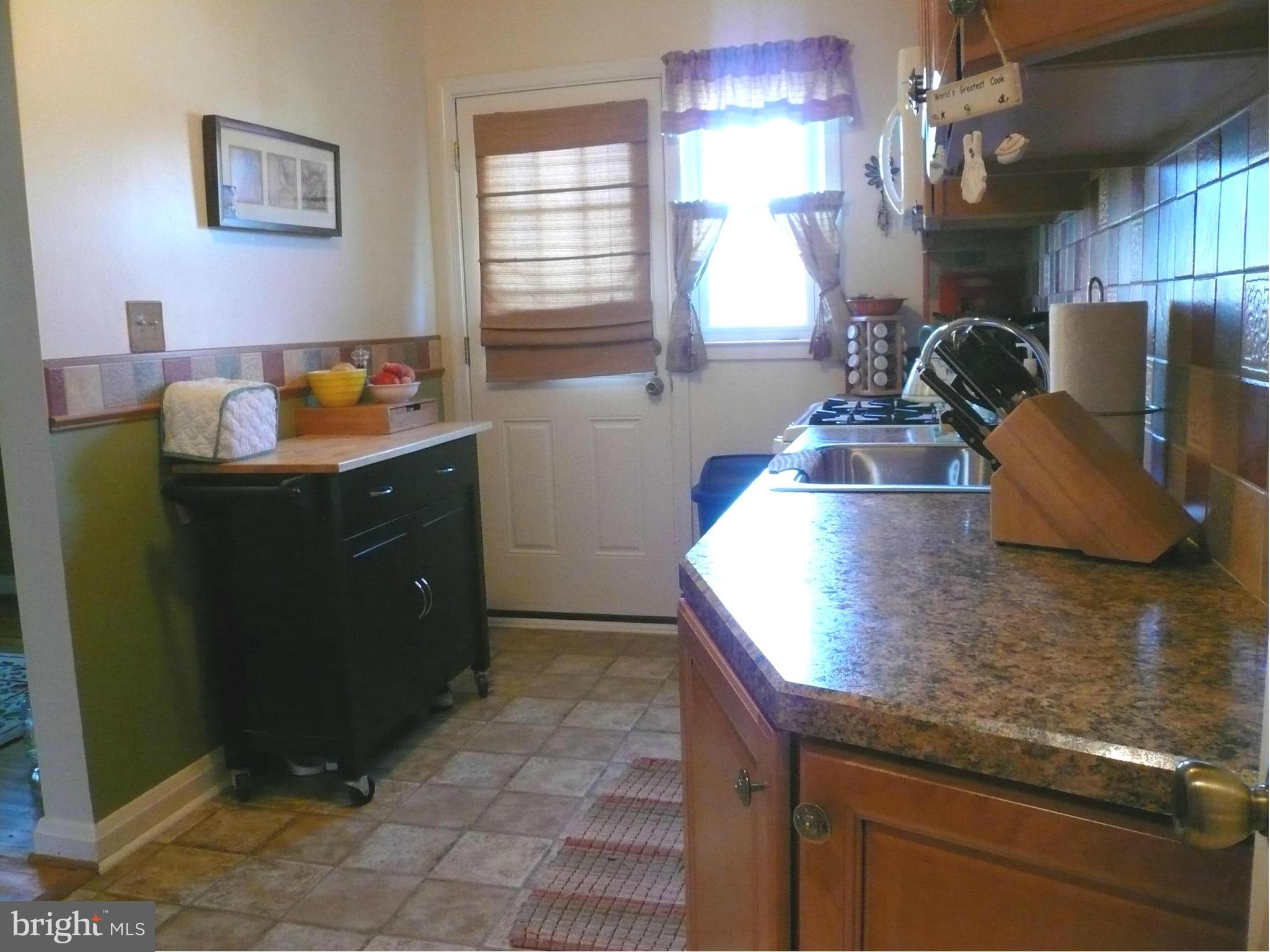 2018 Ormand Road Baltimore, MD 21222 - Photo 7 of 21 a kitchen with a sink a counter space and a window