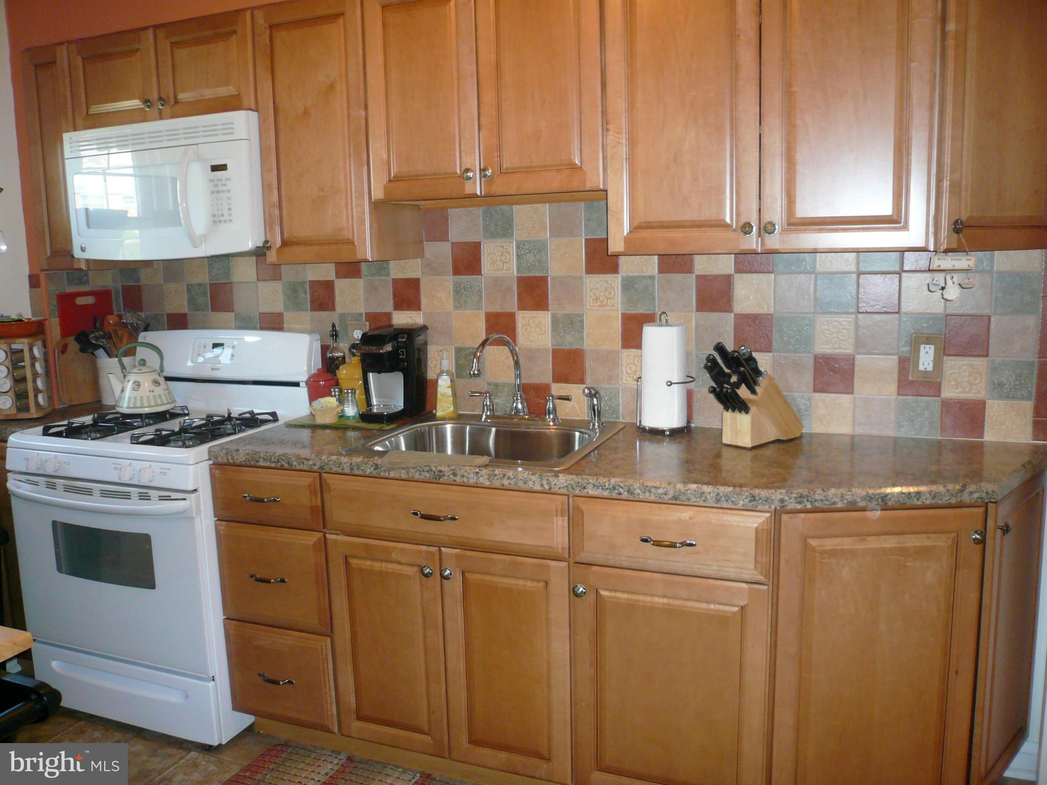 2018 Ormand Road Baltimore, MD 21222 - Photo 8 of 21 a kitchen with stainless steel appliances granite countertop a sink stove and cabinets