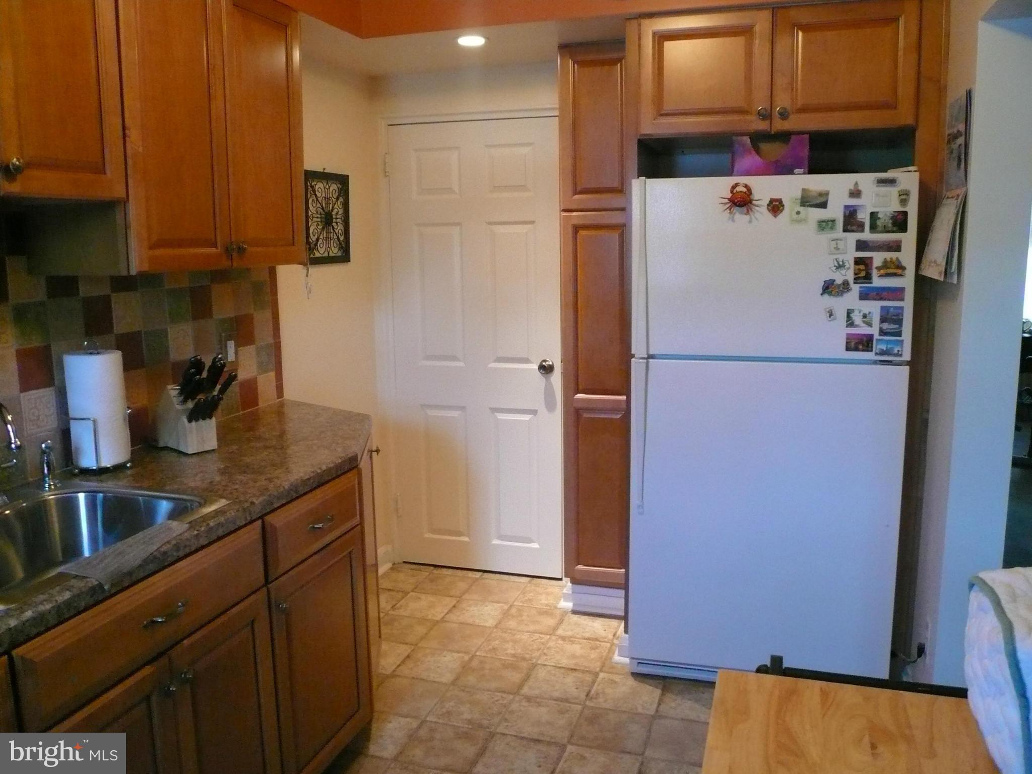 2018 Ormand Road Baltimore, MD 21222 - Photo 10 of 21 a white refrigerator freezer sitting in a kitchen