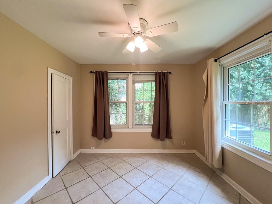 1033 Northwest 22nd Avenue Gainesville, FL 32609 - Photo 11 of 25 a view of an empty room with a window