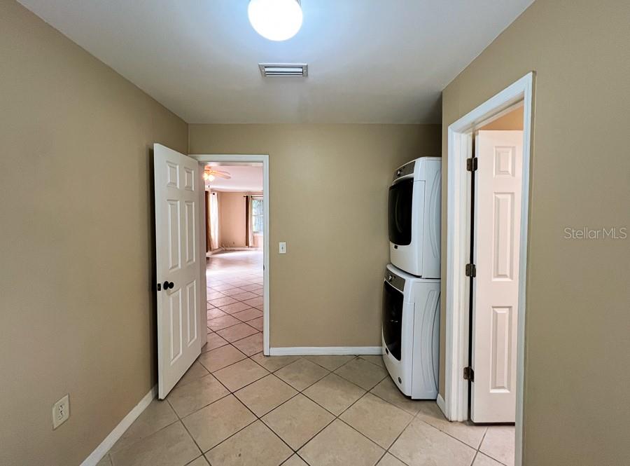 1033 Northwest 22nd Avenue Gainesville, FL 32609 - Photo 23 of 25 a view of a storage & utility room with refrigerator and window