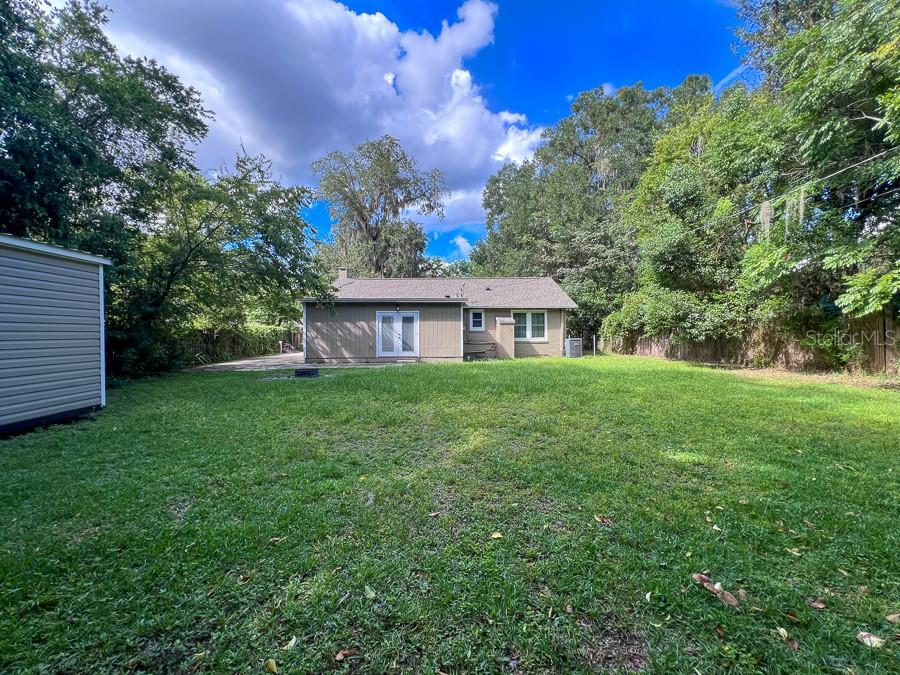 1033 Northwest 22nd Avenue Gainesville, FL 32609 - Photo 25 of 25 a view of house with backyard