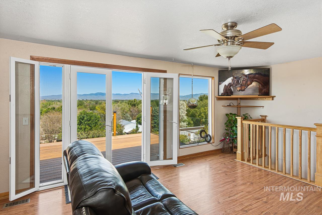 10178 West Fox Ridge Drive Boise, ID 83709 - Photo 6 of 36 Expansive glass doors opening to a large outdoor deck