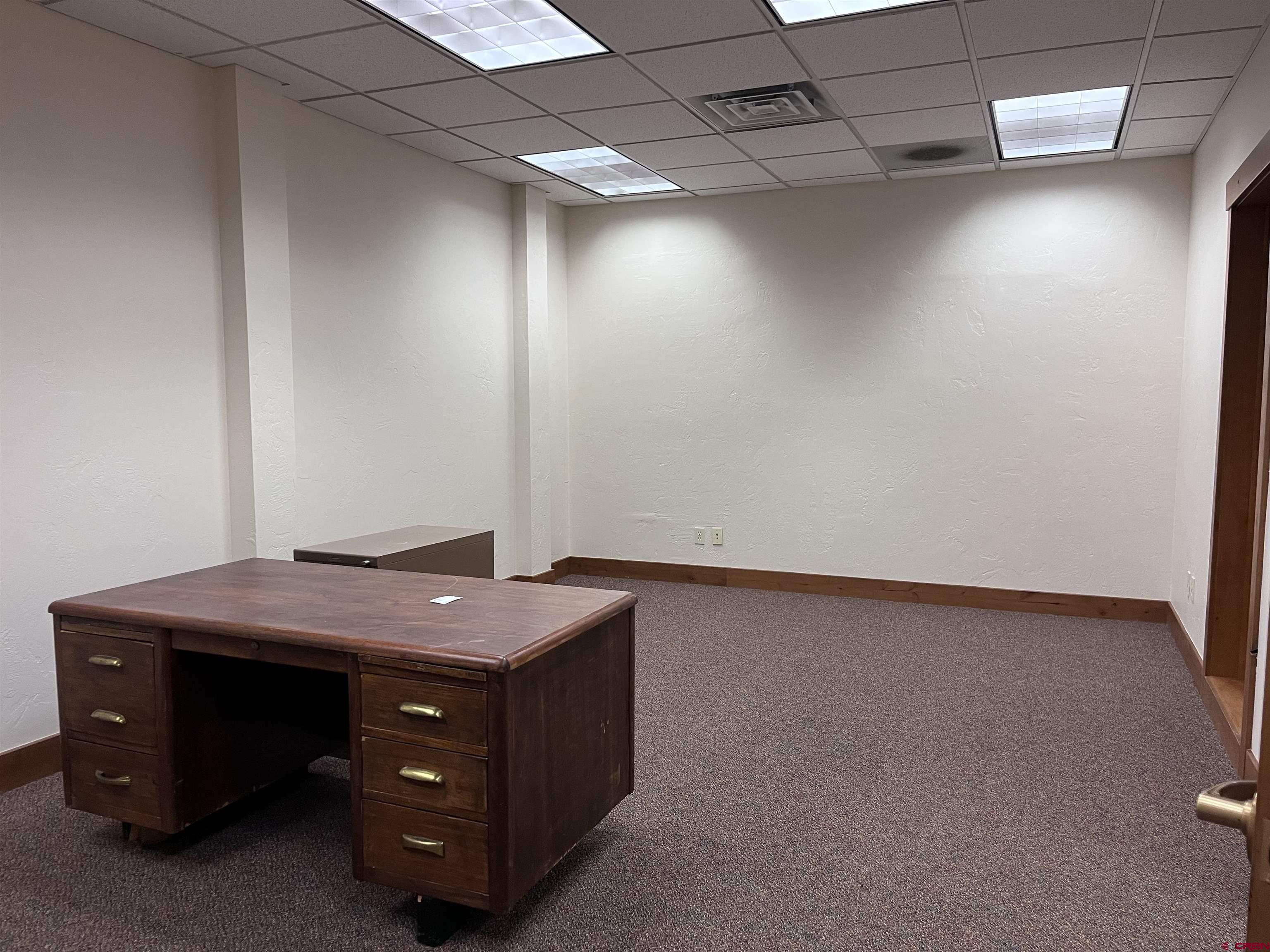 954 East 2nd Avenue, Unit 104 Durango, CO 81301 - Photo 13 of 14 a room with a table and a ceiling fan