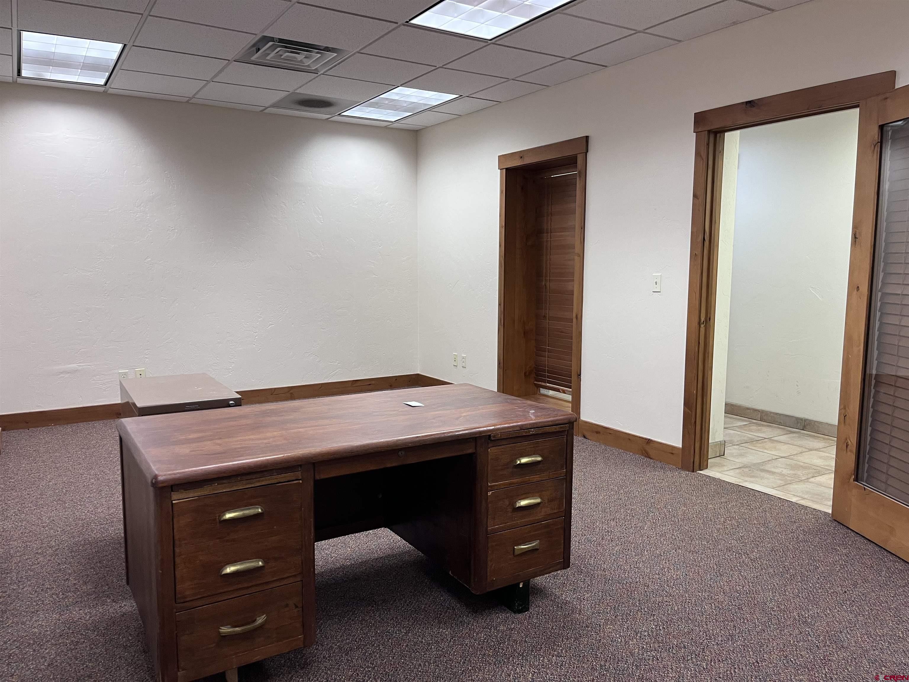 954 East 2nd Avenue, Unit 104 Durango, CO 81301 - Photo 2 of 14 a room with a table and a ceiling fan