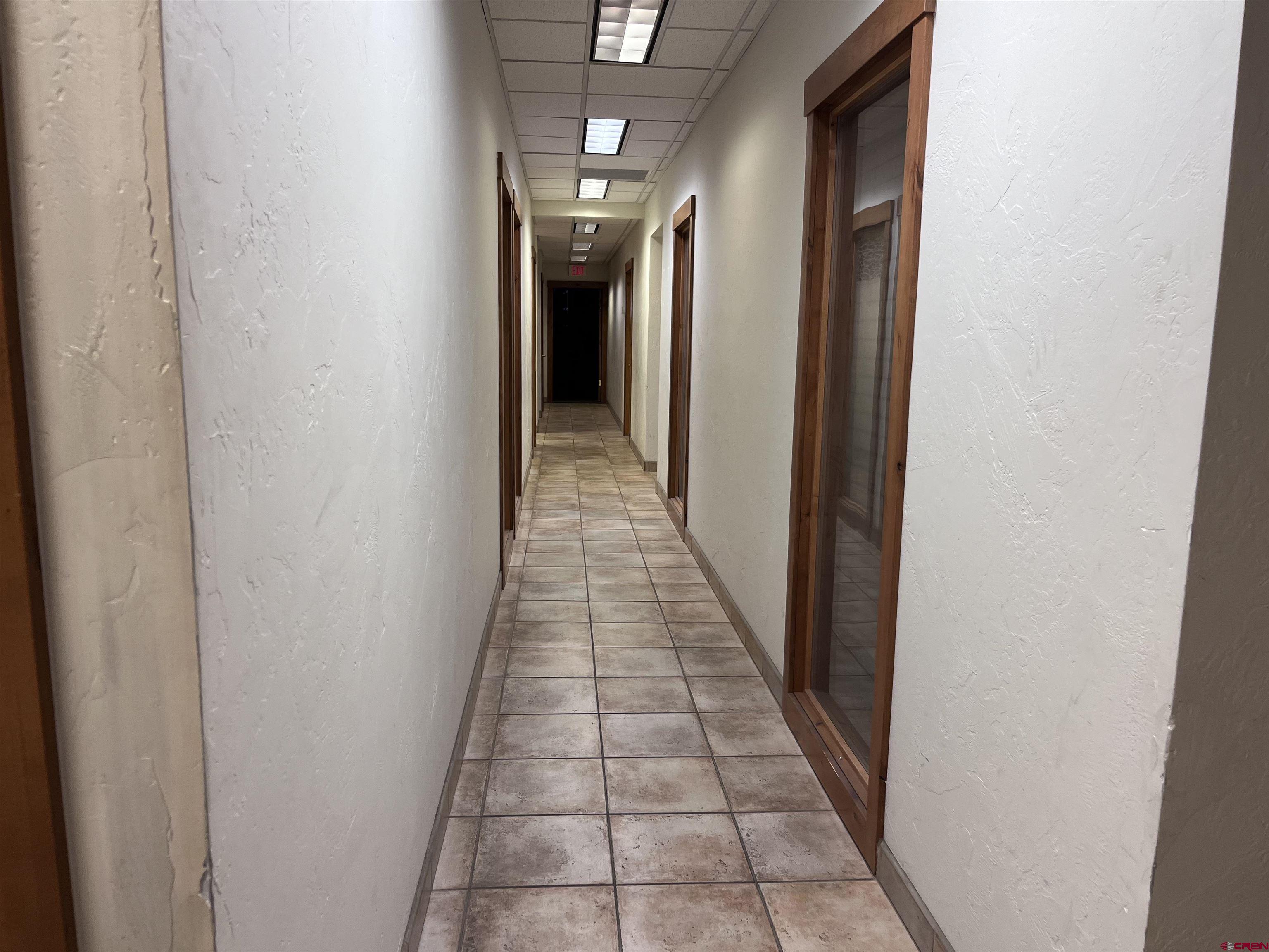 954 East 2nd Avenue, Unit 104 Durango, CO 81301 - Photo 6 of 14 a hallway with wooden floor and a hallway