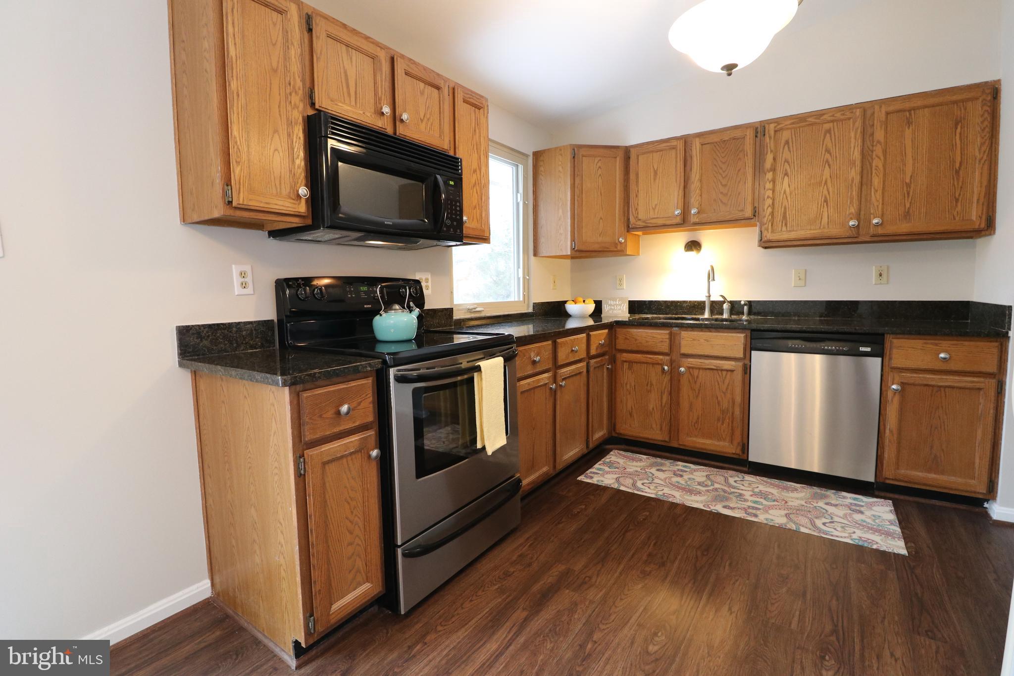 17501 Collier Circle Poolesville, MD 20837 - Photo 10 of 34 Kitchen with stainless appliances and granite