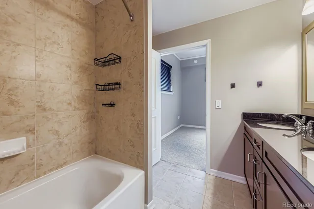 a bathroom with a bathtub and a sink