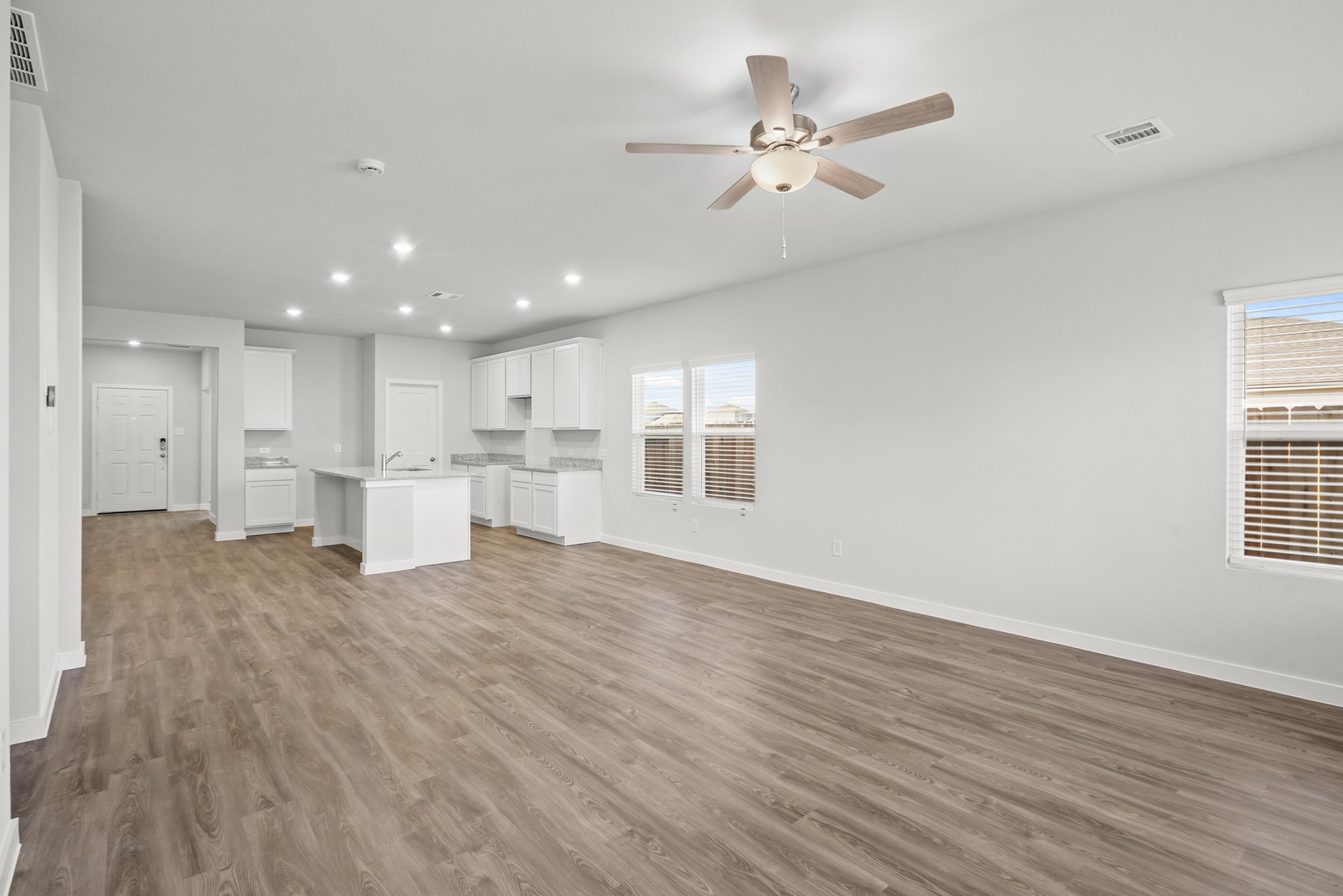 9720 Caney Bend Road Conroe, TX 77303 - Photo 6 of 24 a view of kitchen with wooden floor and window