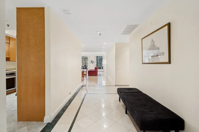 a living room with a couch and a painting on the wall