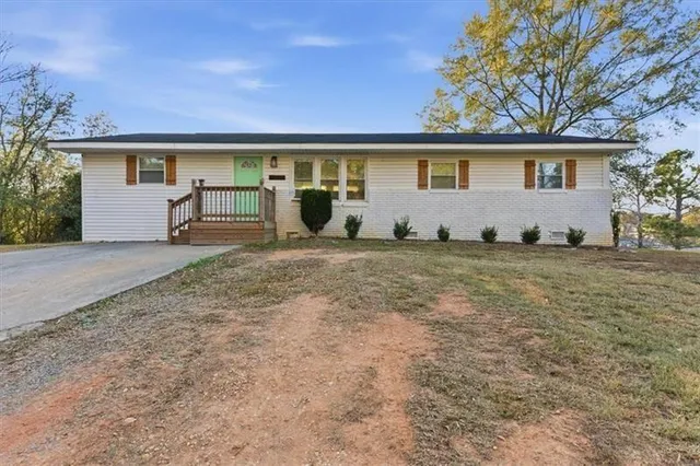 front view of a house with two of trees