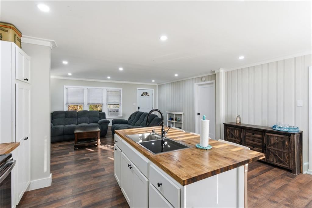 121 Ripley Avenue Adairsville, GA 30103 - Photo 11 of 43 a kitchen with a stove a sink and a refrigerator