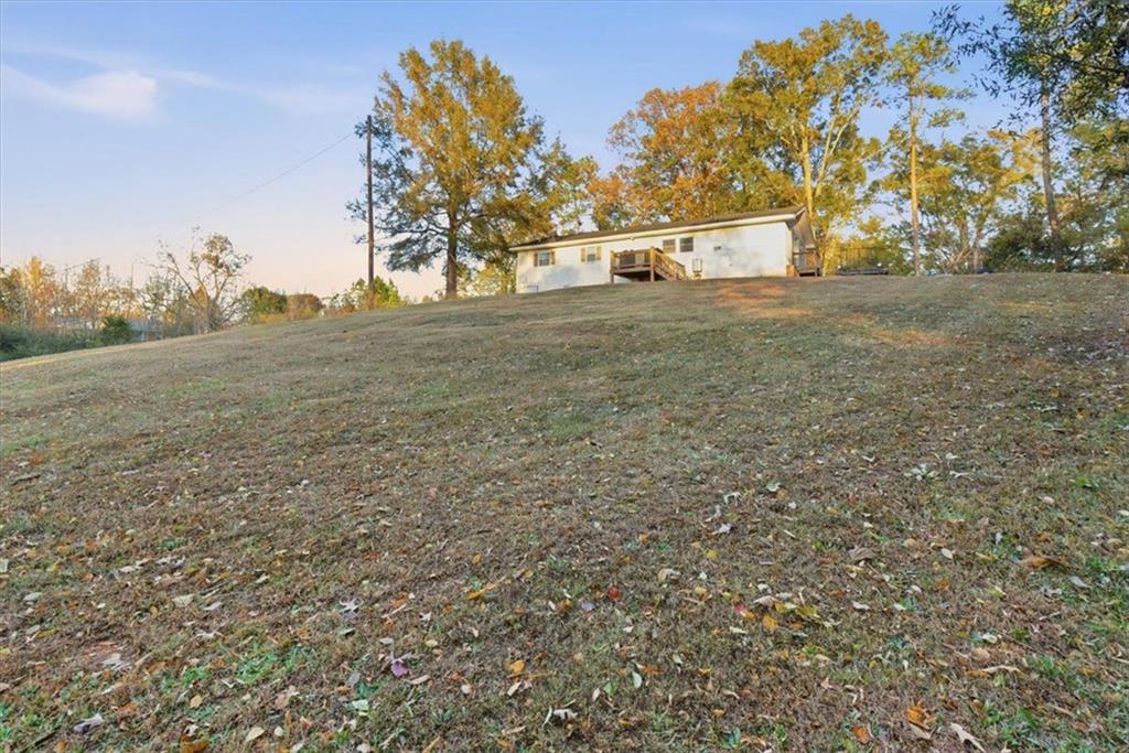 121 Ripley Avenue Adairsville, GA 30103 - Photo 32 of 43 a view of a yard with an trees