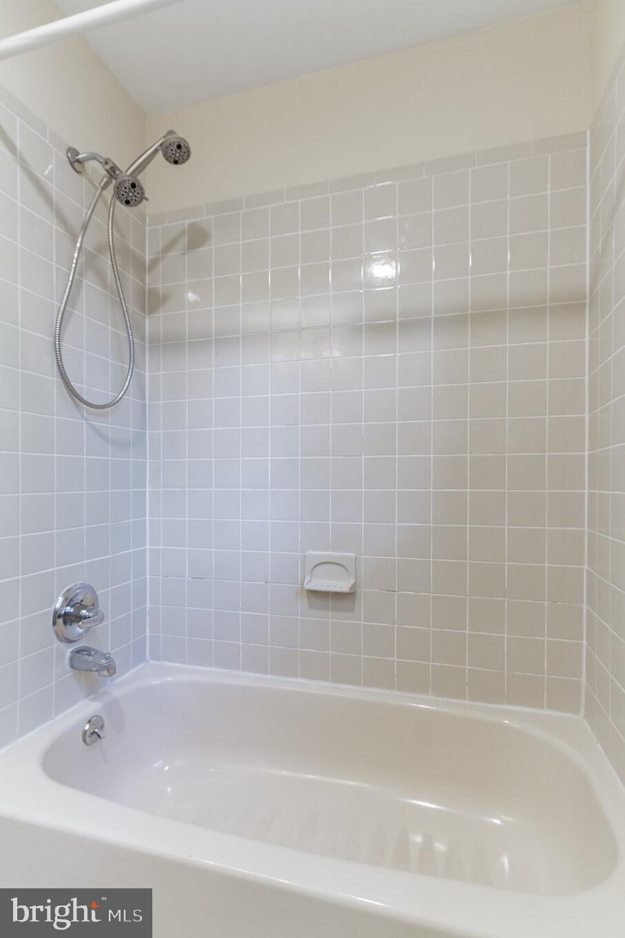 51 Summit Road Malvern, PA 19355 - Photo 34 of 39 Ceramic Tile Hall Bath- Travertine Tile Floor