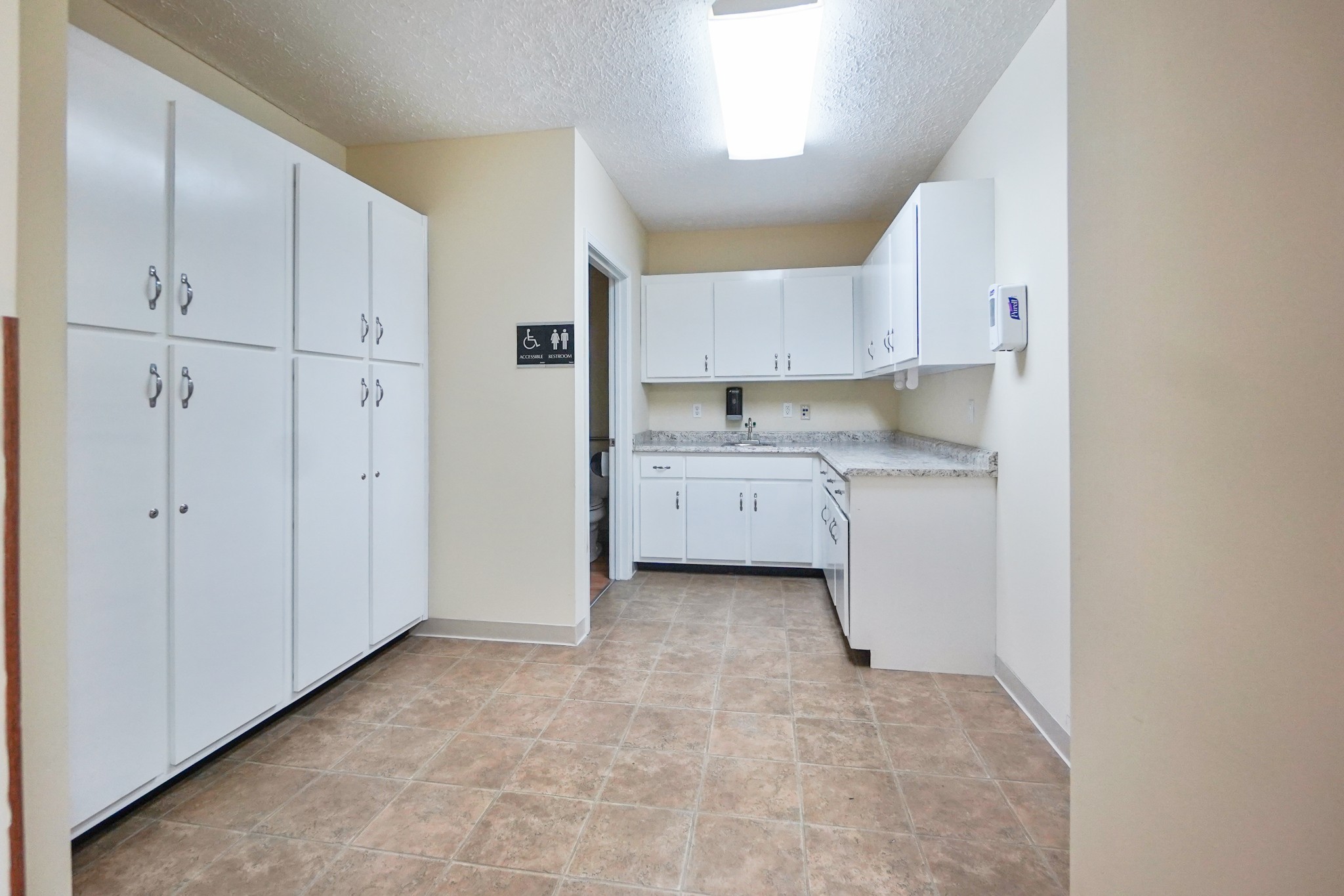1225 Spring Street Dover, TN 37058 - Photo 19 of 47 a view of kitchen with white cabinets stainless steel appliances and a window