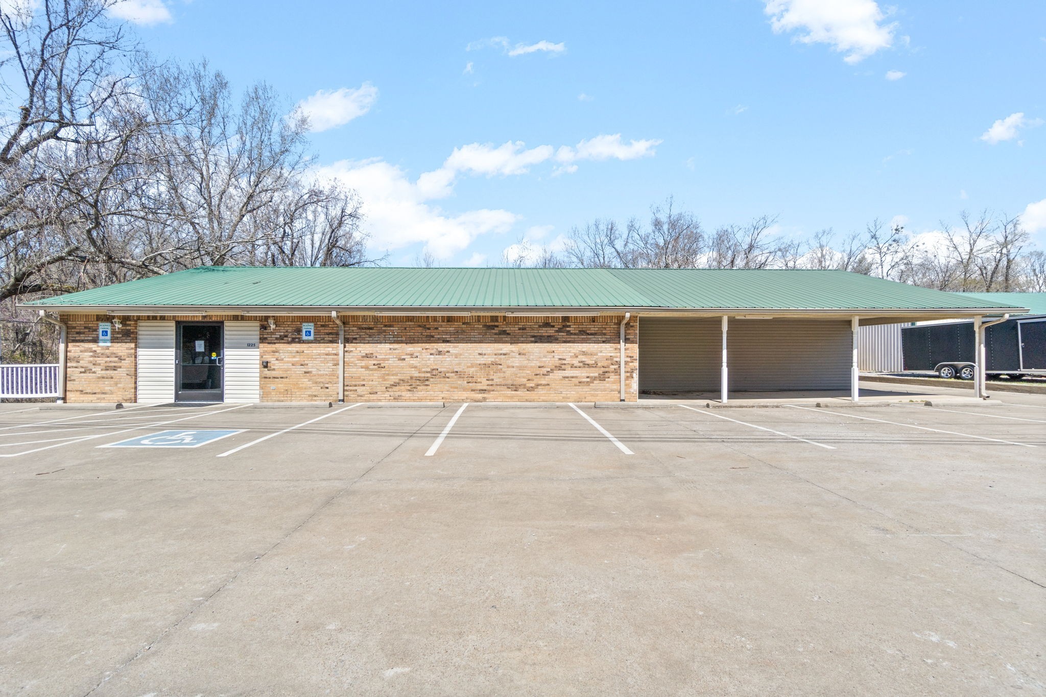 1225 Spring Street Dover, TN 37058 - Photo 25 of 47 front view of a house with a yard and trees