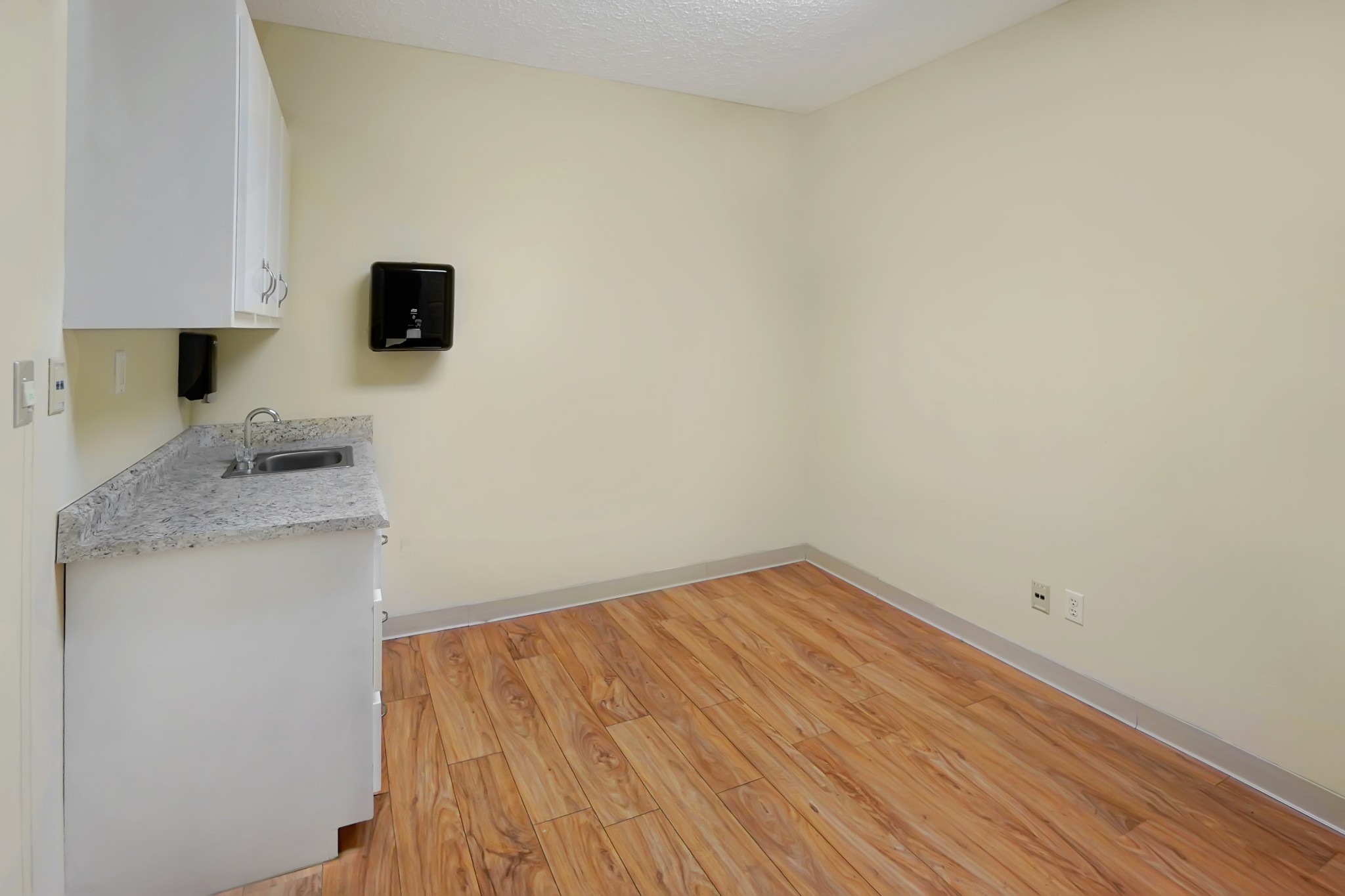 1225 Spring Street Dover, TN 37058 - Photo 10 of 47 a kitchen with a sink and a microwave