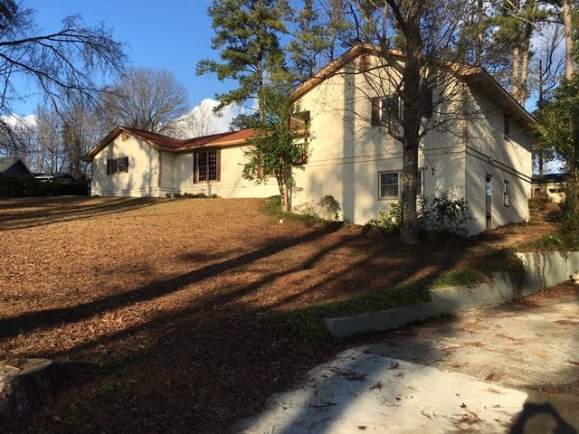6445 Stapleton Road Macon, GA 31206 - Photo 2 of 22 a front view of a house with a yard