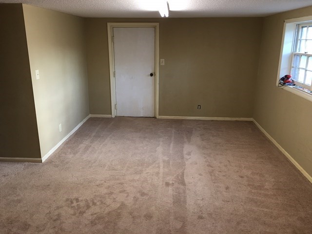 6445 Stapleton Road Macon, GA 31206 - Photo 16 of 22 an empty room with windows